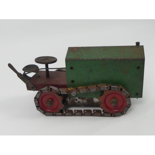 433 - A 1920's tinplate Structo Toys clockwork construction kit model 44 tractor bulldozer.