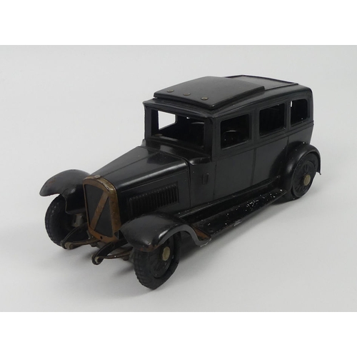 436 - A scarce Bakelite Austin British 1930's sliding roof  clockwork car by Ranlite. 11 x 26 cm.