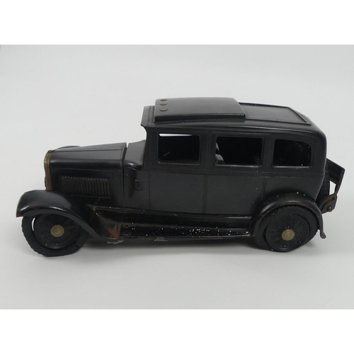 436 - A scarce Bakelite Austin British 1930's sliding roof  clockwork car by Ranlite. 11 x 26 cm.