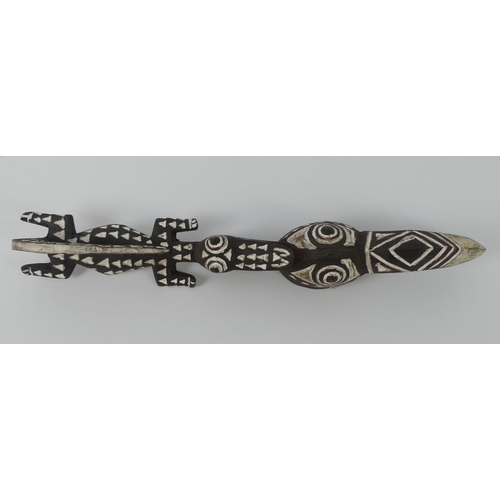 449 - A Burkino Faso carved crocodile and bird mask. 62 x 10 cm.