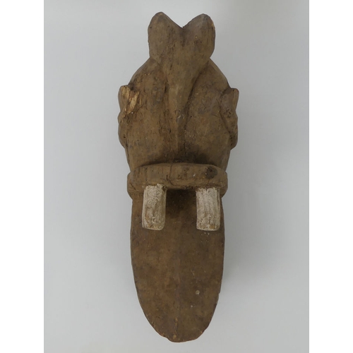 453 - A carved african Nigeria crocodile tribal mask. 40 x 16 cm.