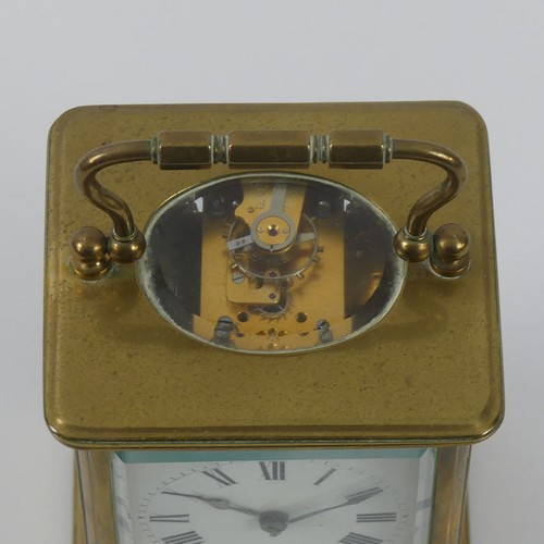 286A - A brass striking carriage clock. 11 x 7 cm.