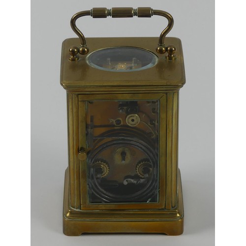 286A - A brass striking carriage clock. 11 x 7 cm.