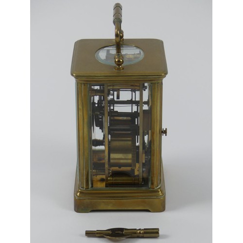 286A - A brass striking carriage clock. 11 x 7 cm.