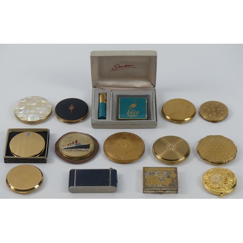 300 - Fourteen Stratton and other assorted design compacts.