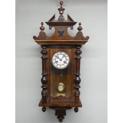 314A - A mahogany Vienna spring driven wall clock, 36cm x 97cm.