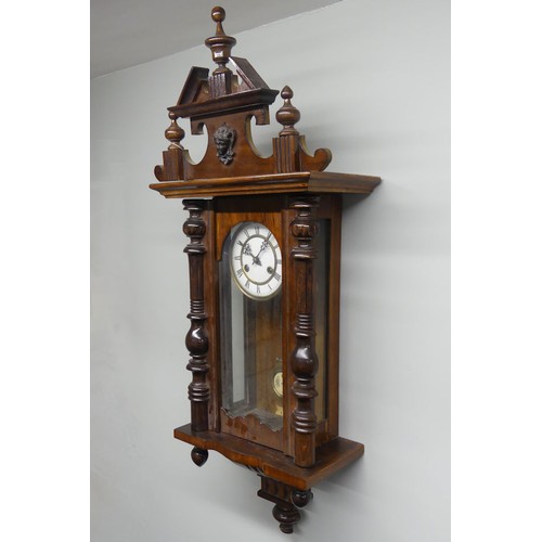 314A - A mahogany Vienna spring driven wall clock, 36cm x 97cm.