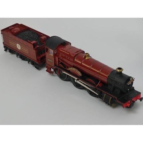 401 - A box of railway locomotives, including Ace 0 gauge coaches, Lionel 0 gauge Hogwarts express locomot... 