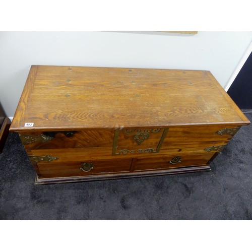 492 - An oak and cedar chest with drawers below, having brass mounts and fittings, 60cm x 128cm.  Collecti... 