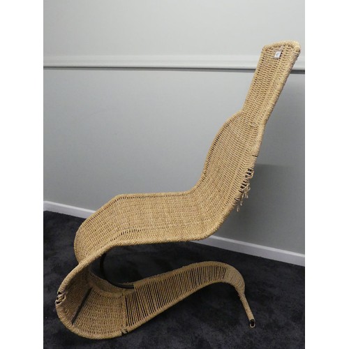 497 - Tom Dixon designed speed model lounge chair, C.1990 with a wrought iron frame and rattan cane seat, ... 