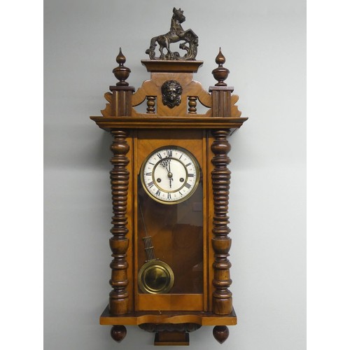 308 - A C.1885 mahogany Vienna Spring driven wall clock with carved horse finial. H85cm X W32cm. Collectio... 