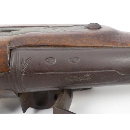 192 - A flintlock mahogany stock blunderbuss with brass fittings, marked 84-86 to the barrel. Length 39 cm... 