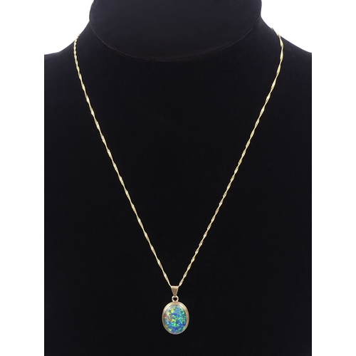 14 - 9ct gold opal doublet pendant and chain, 3.2grams, chain 44cm, pendant 24mm.