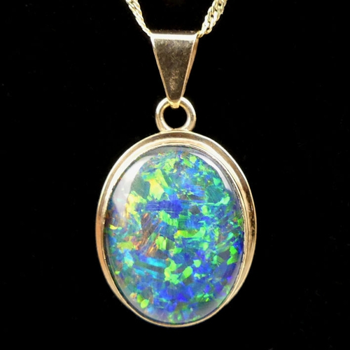 14 - 9ct gold opal doublet pendant and chain, 3.2grams, chain 44cm, pendant 24mm.