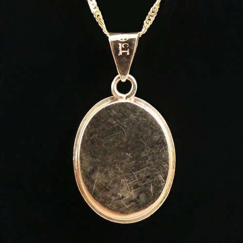 14 - 9ct gold opal doublet pendant and chain, 3.2grams, chain 44cm, pendant 24mm.