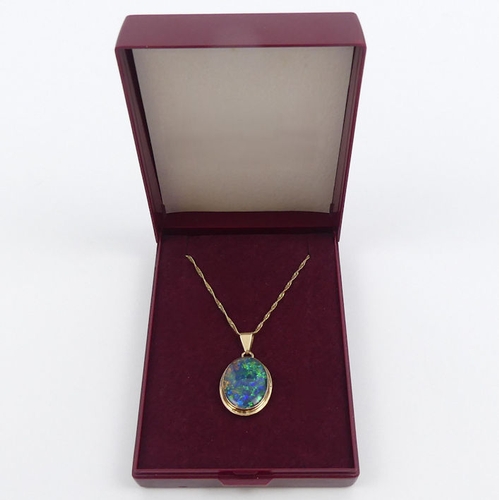 14 - 9ct gold opal doublet pendant and chain, 3.2grams, chain 44cm, pendant 24mm.