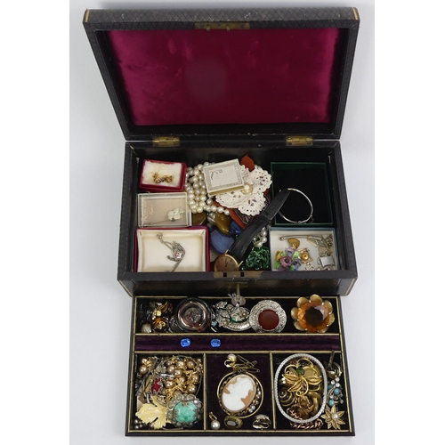 23 - A jewellery box and contents, including silver and gold items along with a rolled gold charm bracele... 