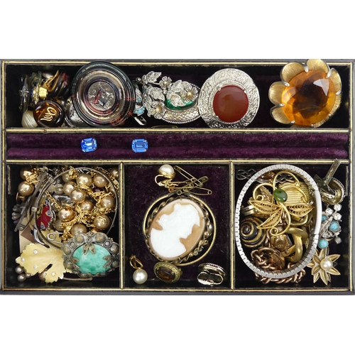 23 - A jewellery box and contents, including silver and gold items along with a rolled gold charm bracele... 