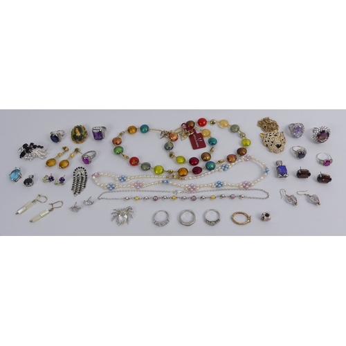 35 - A box of silver rings, pendants and Murano items and a leopards head pendant.