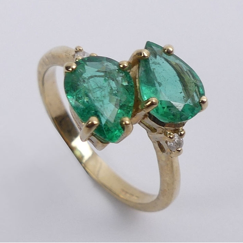 42 - 9ct gold, pear shaped emerald two stone ring with diamond shoulders, 2.6 grams, 12.3mm, size M.