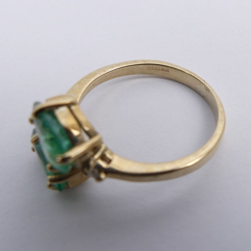 42 - 9ct gold, pear shaped emerald two stone ring with diamond shoulders, 2.6 grams, 12.3mm, size M.