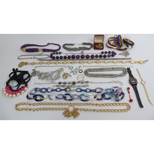 9 - A large box of mixed costume jewellery, including some silver items.