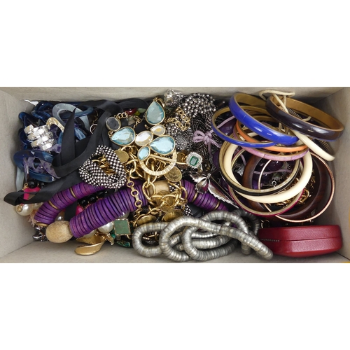 9 - A large box of mixed costume jewellery, including some silver items.