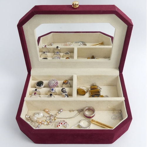 10 - A jewellery box and contents, including a silver tigers-eye pendant and chain.