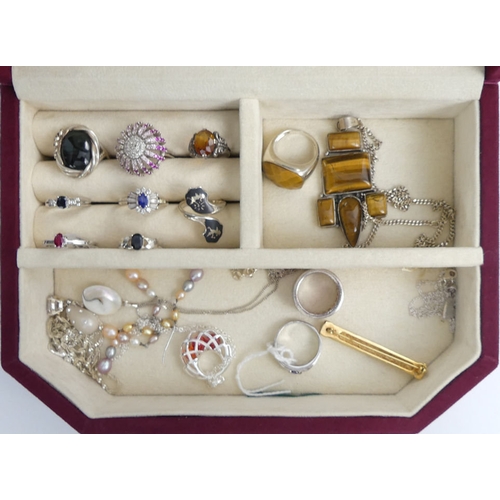 10 - A jewellery box and contents, including a silver tigers-eye pendant and chain.