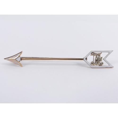 12 - 9ct gold enamel and diamond arrow brooch, 3 grams, 65mm.