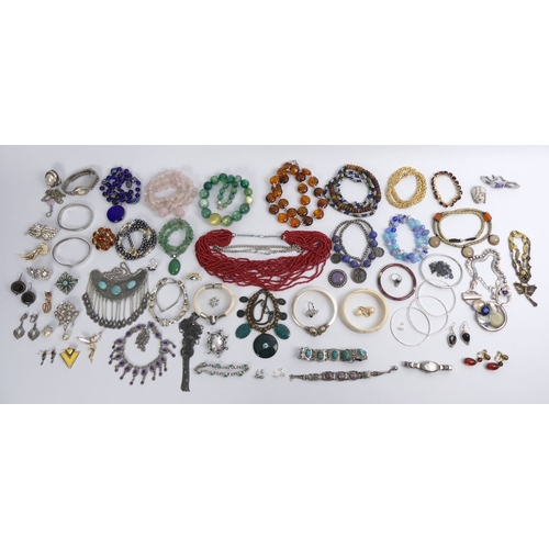 19 - A tin of mixed costume jewellery, including silver items and stone necklaces.