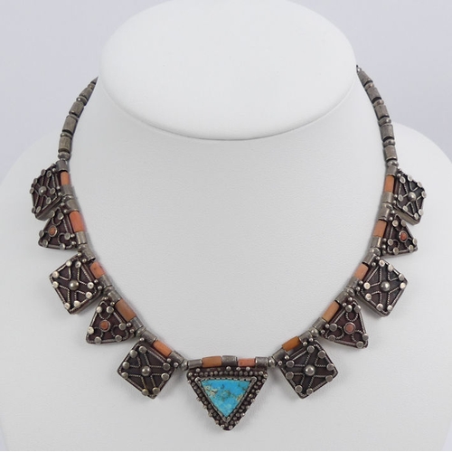 23 - Signed Native American silver turquoise and coral necklace, 57.4 grams, 41mm x 25mm.