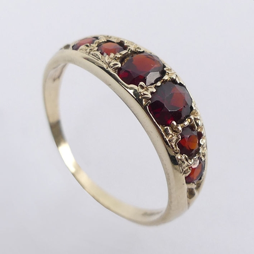 35 - 9ct gold six stone garnet ring, 2.4 grams, 6.1mm, size S.