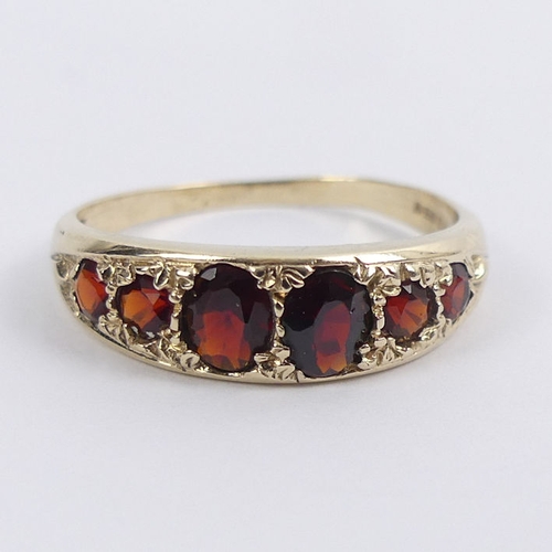 35 - 9ct gold six stone garnet ring, 2.4 grams, 6.1mm, size S.