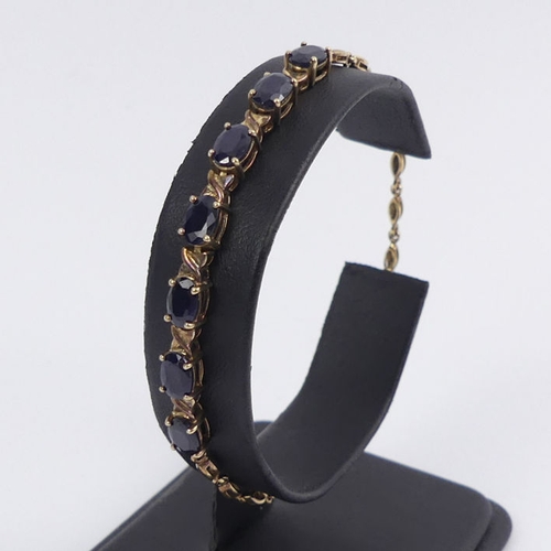 42 - Sterling silver gilt and sapphire set bracelet, 4.8 grams, 19cm.