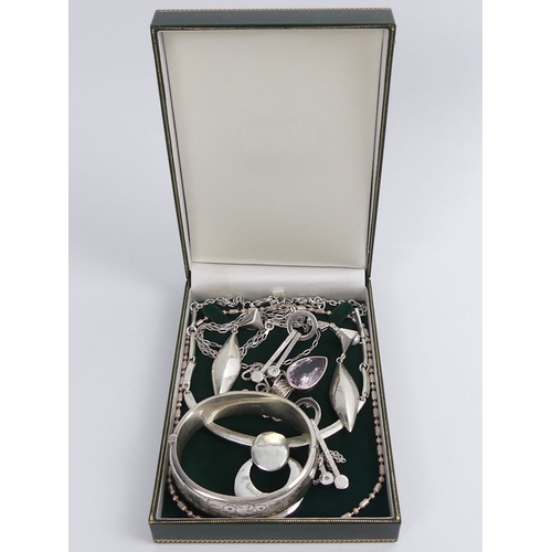 53 - A box of silver jewellery including a hinged bangle and an amethyst pendant and chain, 135 grams.