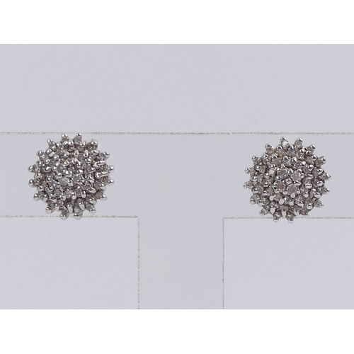 56 - A pair of 9ct gold diamond cluster earrings, 3.5 grams, 12mm.