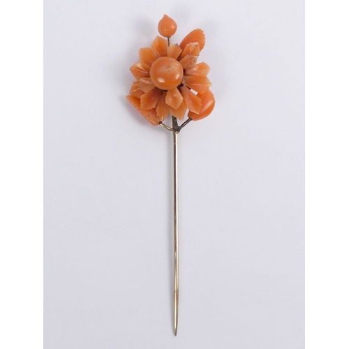 62 - Victorian carved coral and 9ct gold (tested) stick pin, 3.4 grams, 75mm.