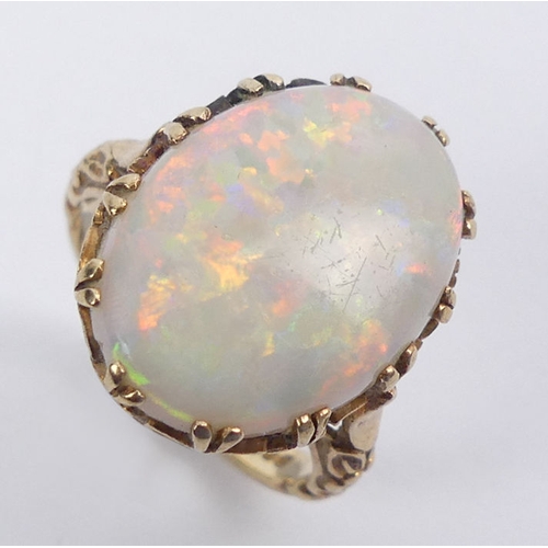 65A - 9ct gold opal ring, 4.6 grams, 19mm, size M.