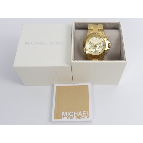 118 - Michael Kors gold tone, chronograph gents watch, boxed, 46mm.
Condition Report: In working order.