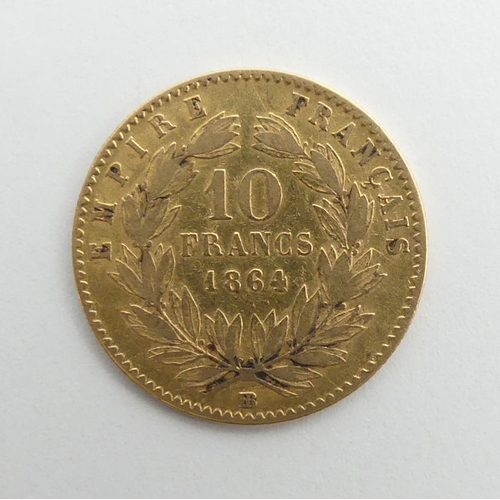 144 - Napoleon III 1864 gold 10 francs coin.. 3.2 grams.