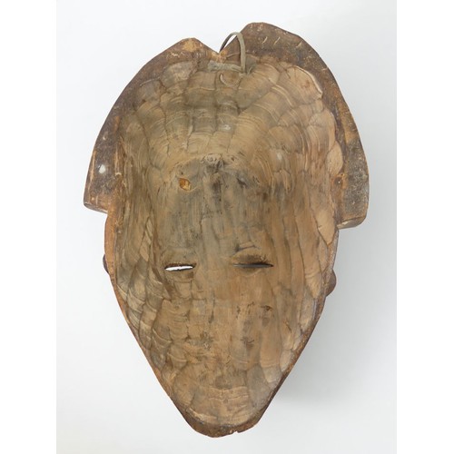 469 - A carved Cameroon Tika tribal mask, 43cm x 28cm.