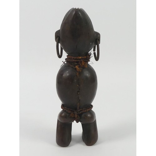 473 - An African carved female fertility figure, 27cm.