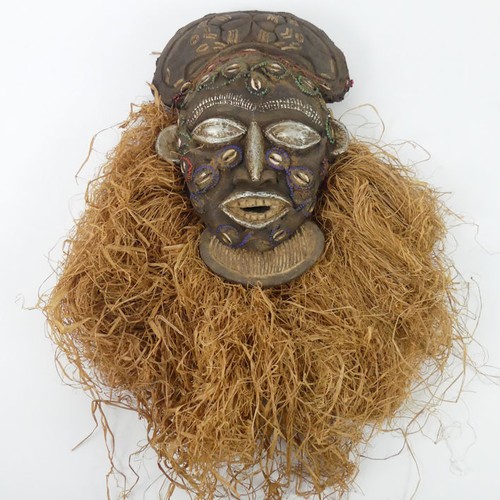 474 - A carved Angolan Chokwe tribal mask, 48cm x 29cm.