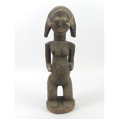 475 - An African carved female fertility figure, 52cm.