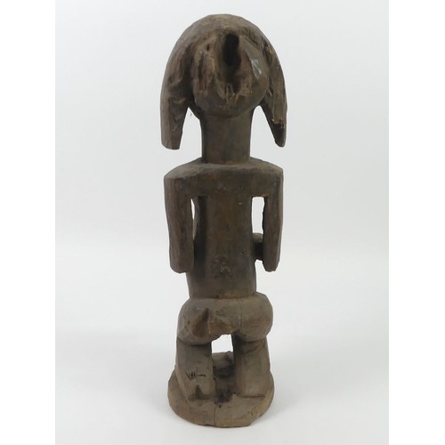 475 - An African carved female fertility figure, 52cm.