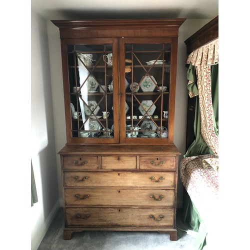 491A - A 19th century mahogany bookcase, the base with three over three drawers, arranged with a matched gl... 