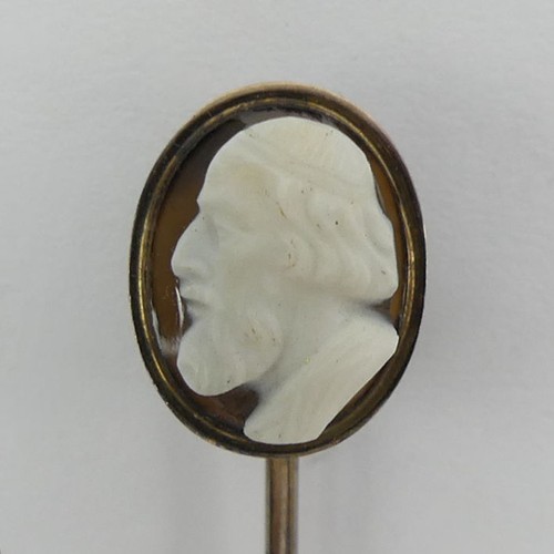 74 - 9ct gold, (tested) finely carved hardstone cameo stick pin, 1.6 grams, 67mm.