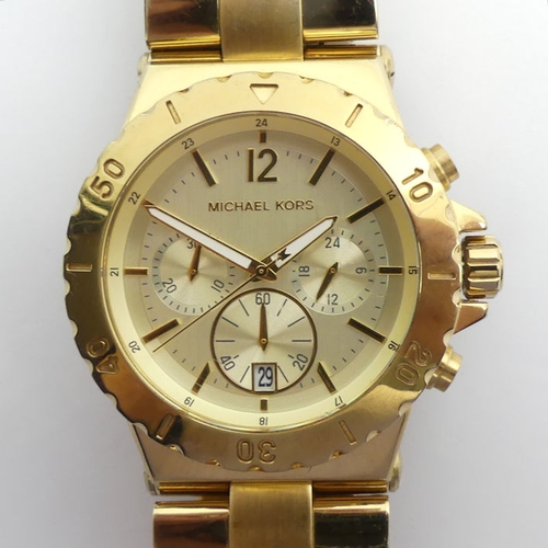 105 - Michael Kors gold tone, chronograph gents watch, boxed, 46mm.
Condition Report: In working order.