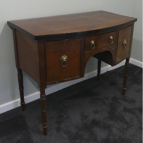 483 - A 19th century mahogany bow front sideboard with lion mask handles. 90cm high x 114cm wide. Collecti... 